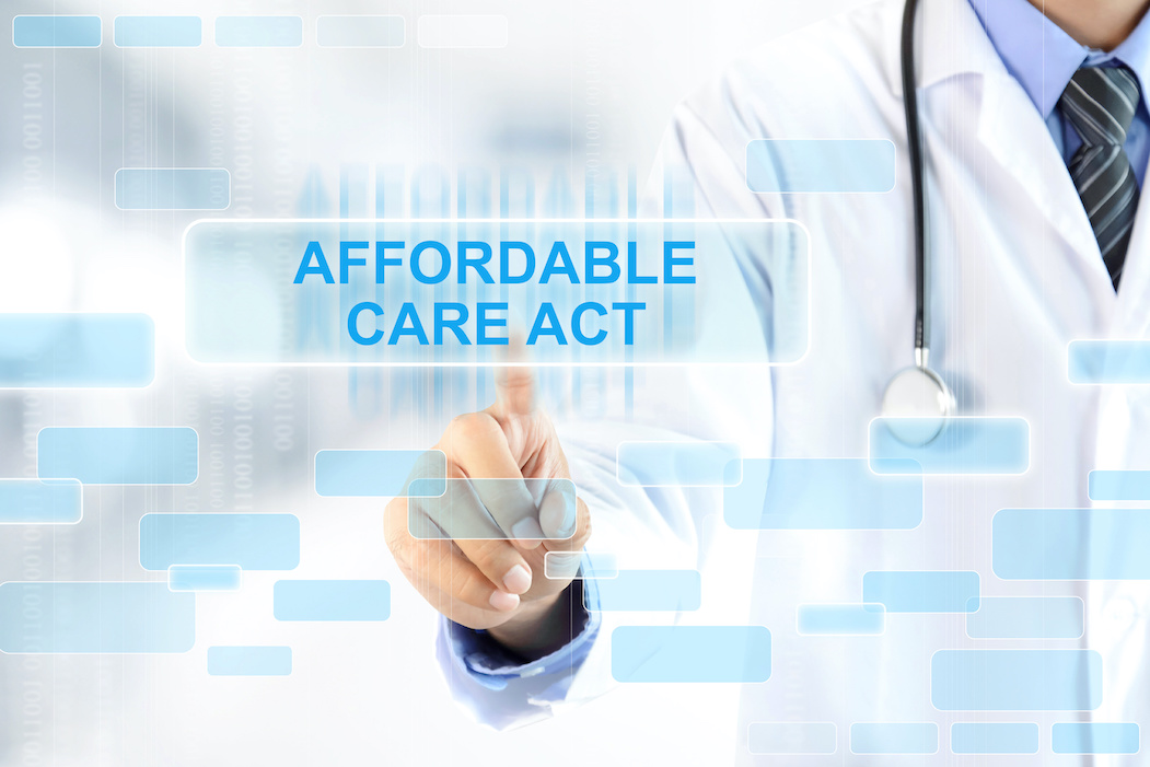 Doctor pointing to Affordable Care Act text | ACA Reporting | CTR Payroll Pittsburgh