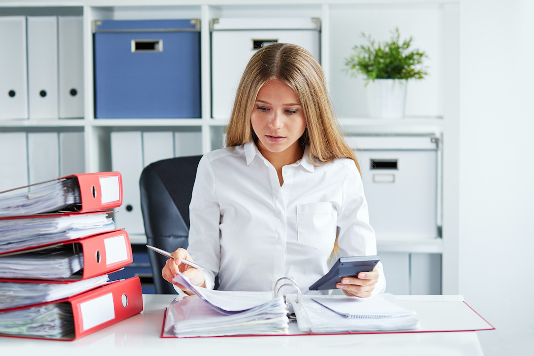 Woman doing paperwork for Year-End Payroll | CTR Payroll | Pittsburgh