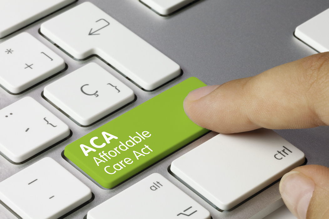 Hitting computer key labeled ACA | ACA Reporting Deadline | CTR Payroll Pittsburgh